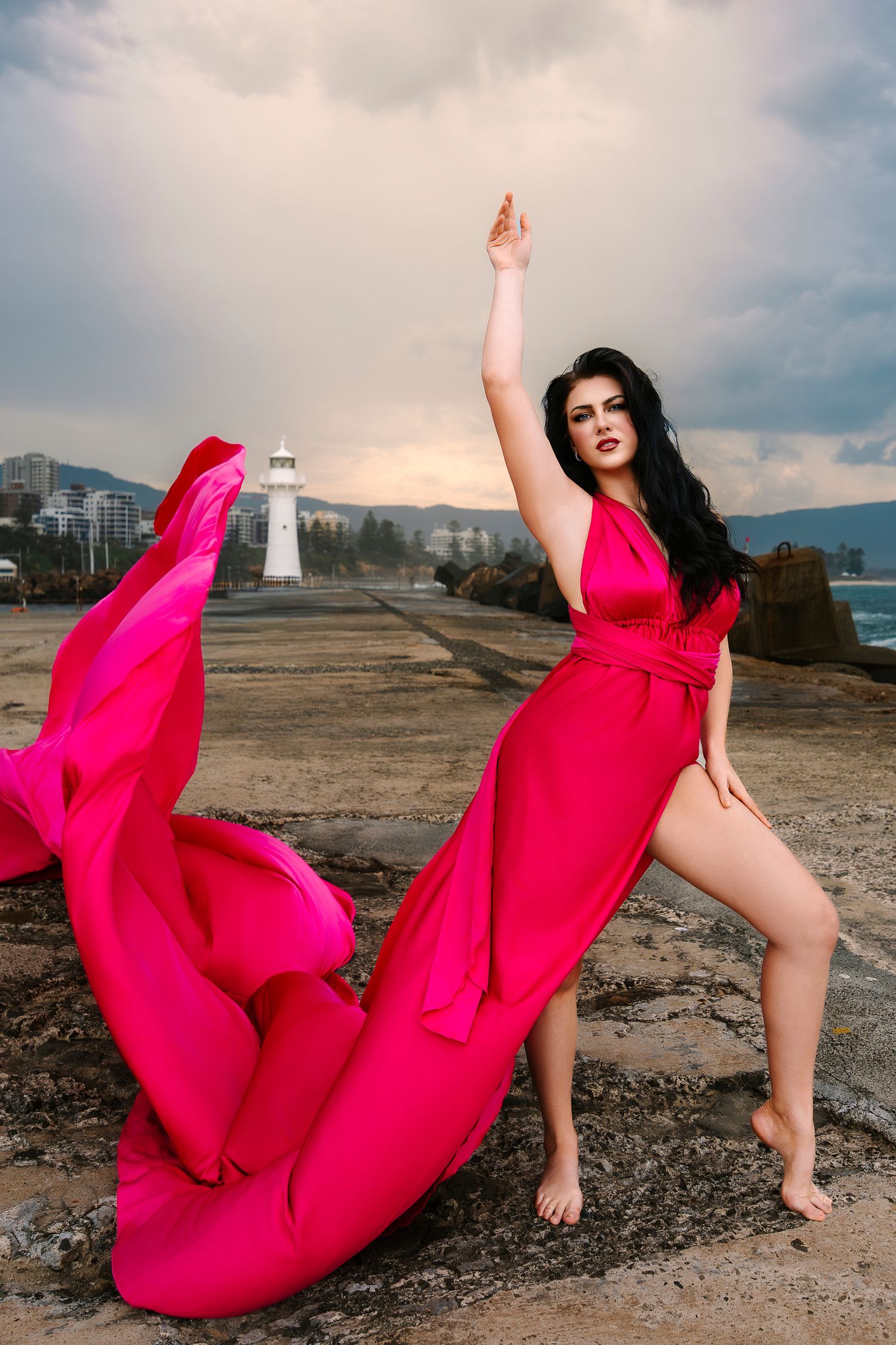 Creative coastal portrait in a flying dress photographed in Wollongong.