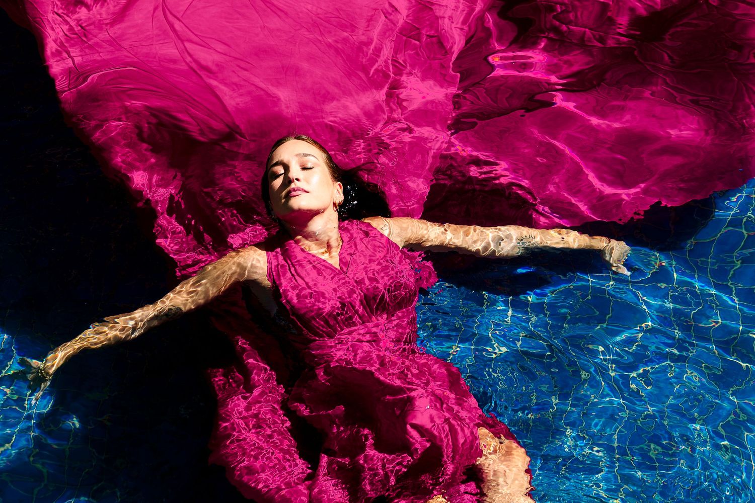 Creative coastal portrait in a flying dress photographed in Wollongong.