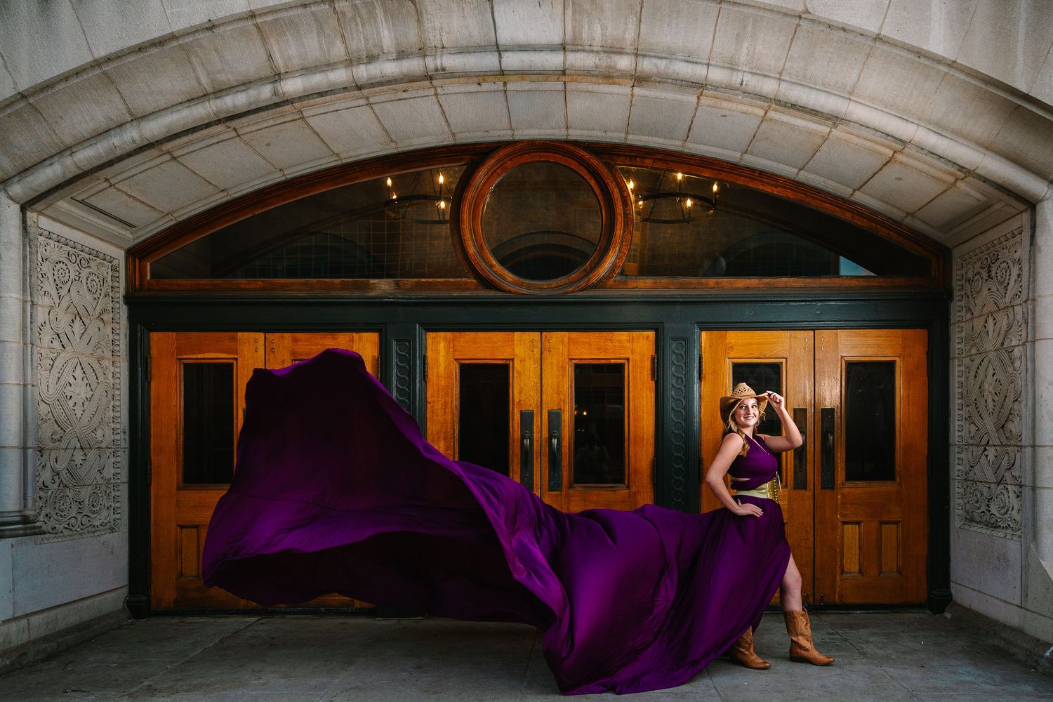 Wollongong Flying Dress Photographer. Woman in Plum Flying Dress at St Louis Union Station Hotel.