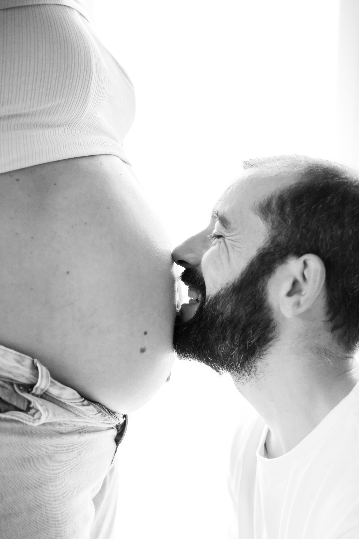 A black and white artistic photo series showing a bearded profile in multiple overlapping views against a white background.