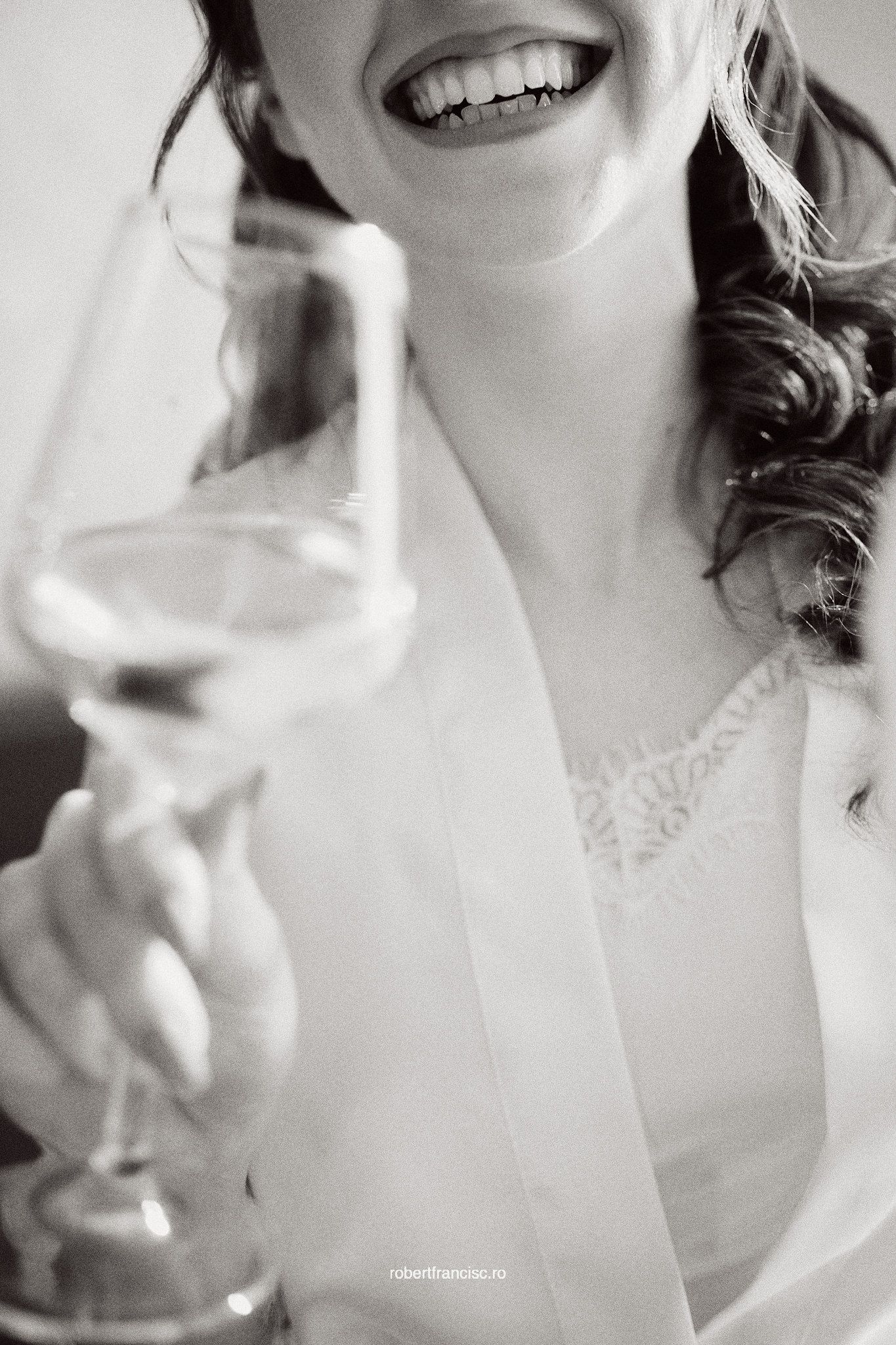 Black and white photo series showing joyful expressions and genuine smiles in a candid portrait session.