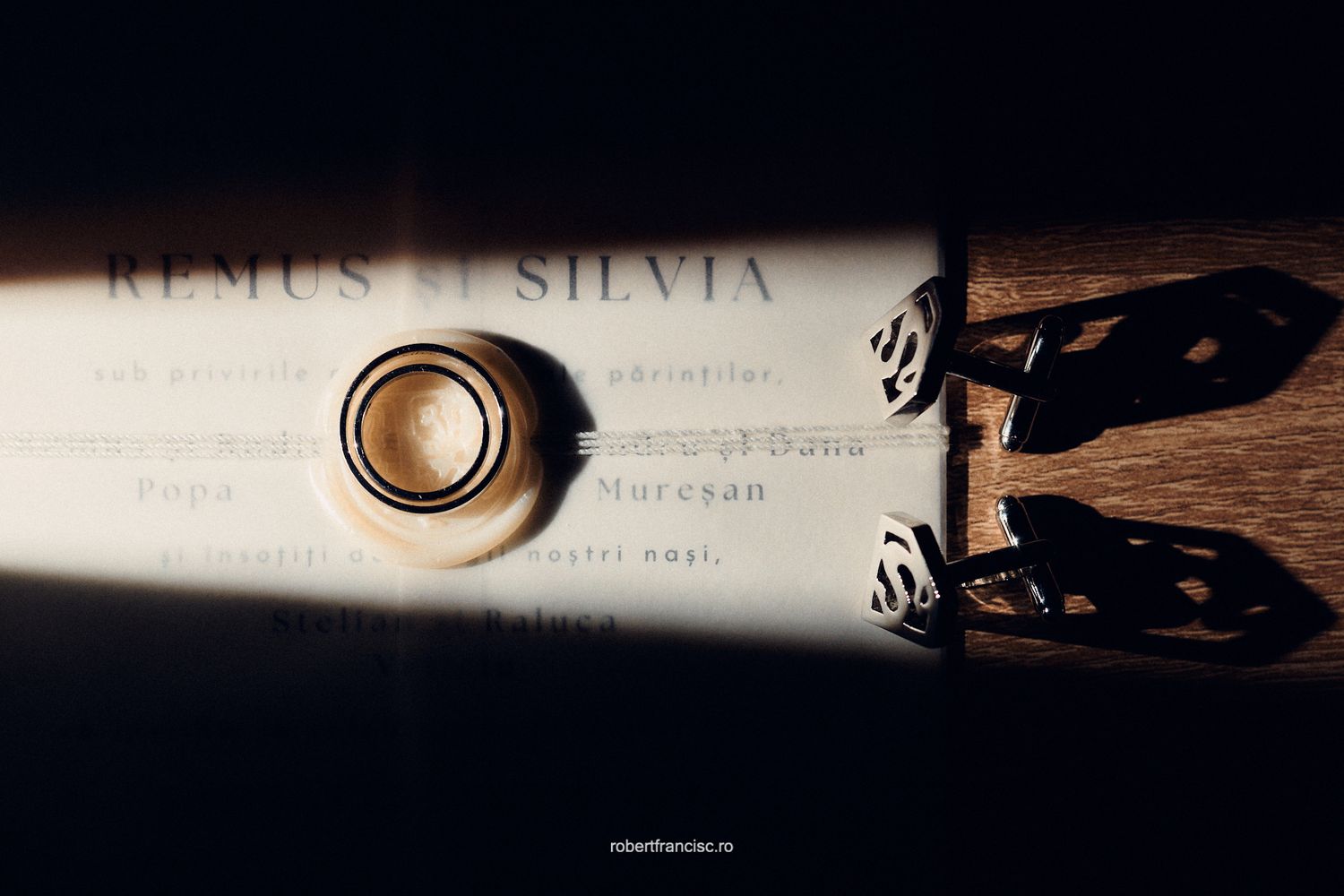 A black and white cinematographic series of vintage film reel closeups showing text and frame edges in dramatic lighting.