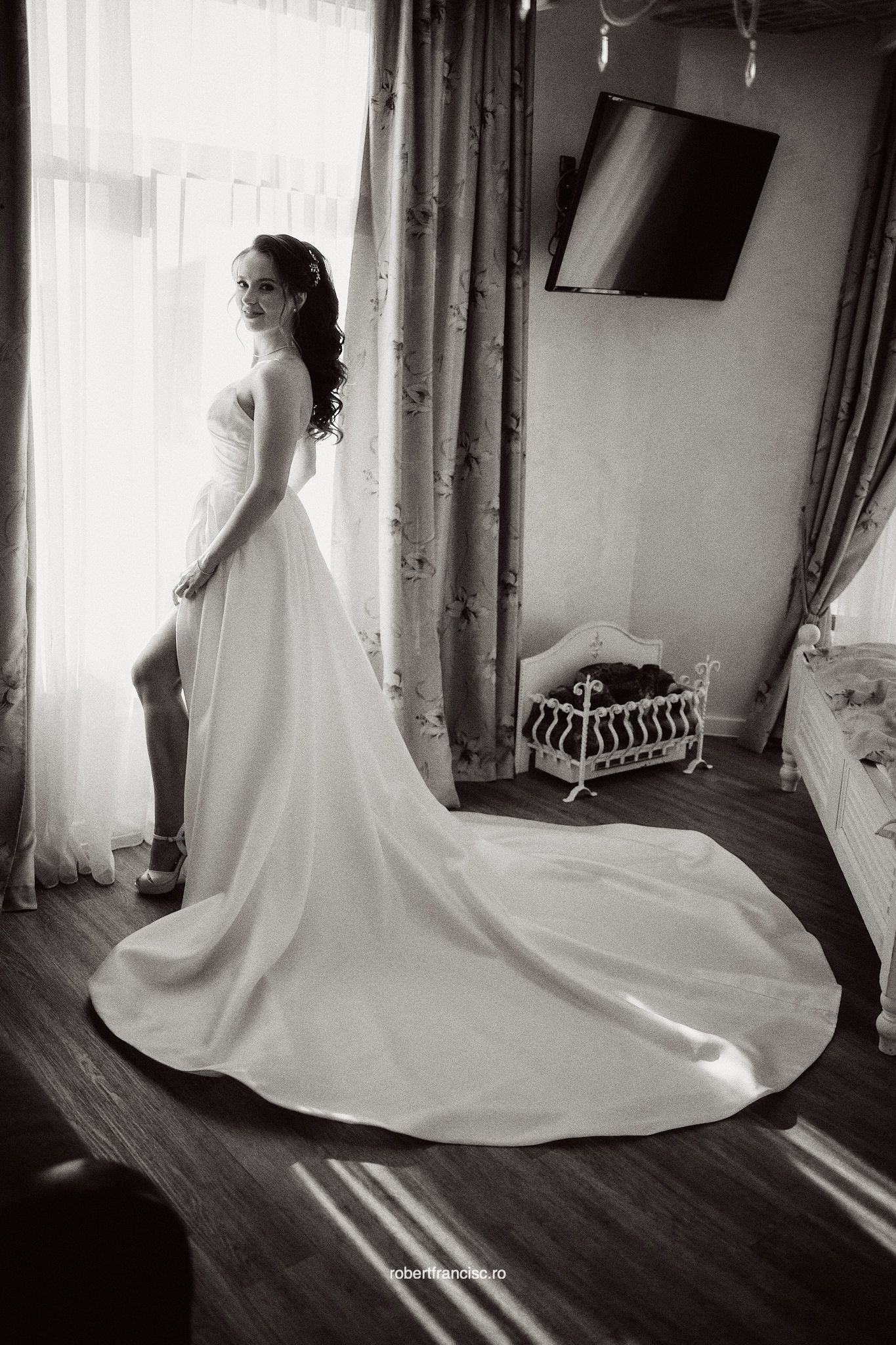 Elegant wedding dress with flowing train captured in a series of black and white photos showing movement and light.