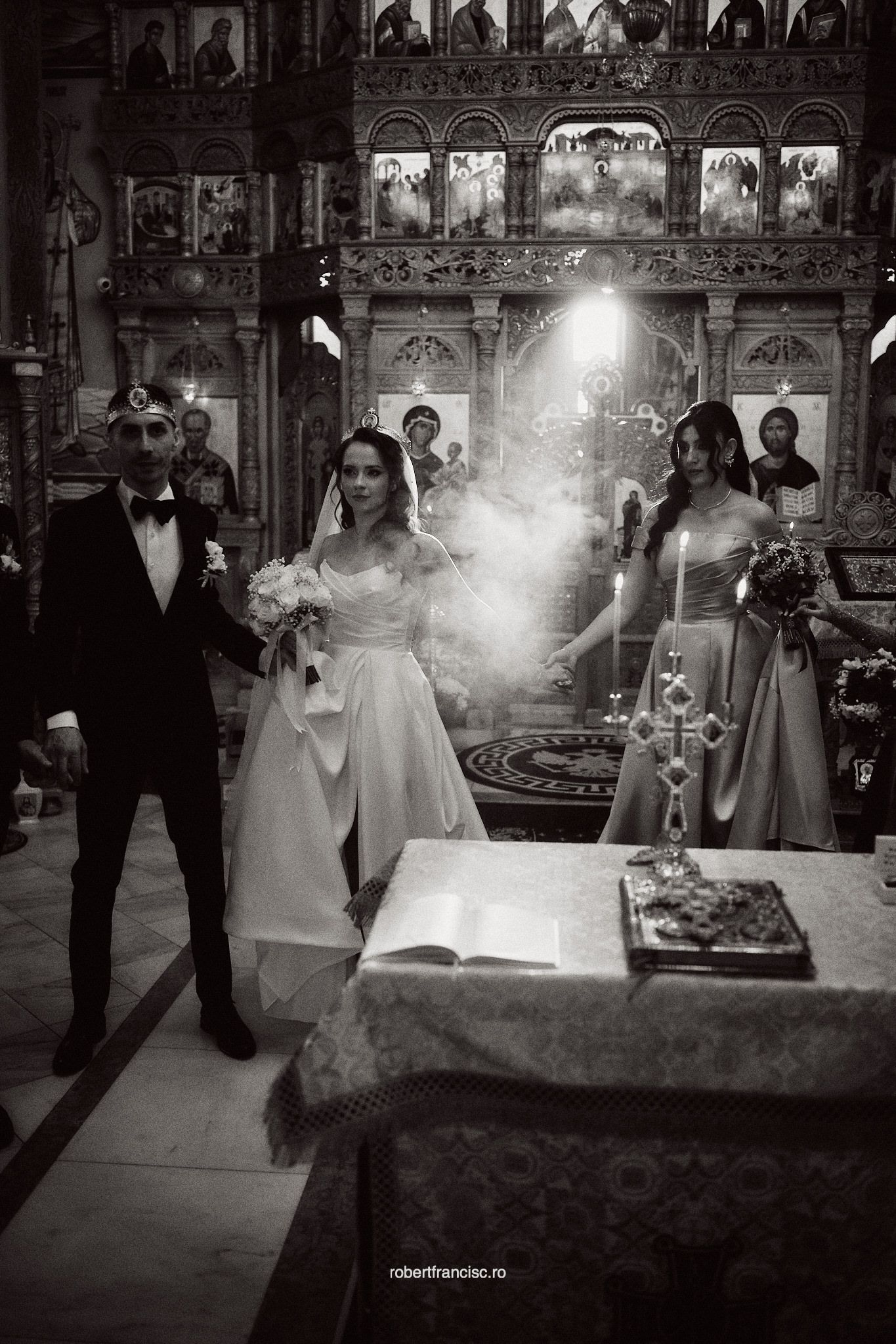 Black and white wedding ceremony photos showing religious ceremony with candles and incense in an Orthodox church.