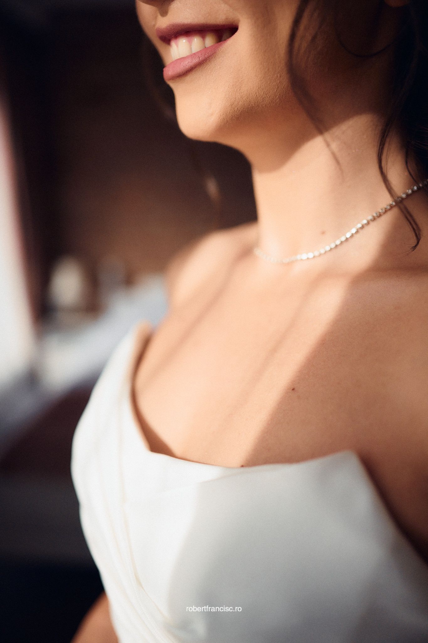 Close-up series showing delicate pearl necklace and white dress details in soft natural lighting.