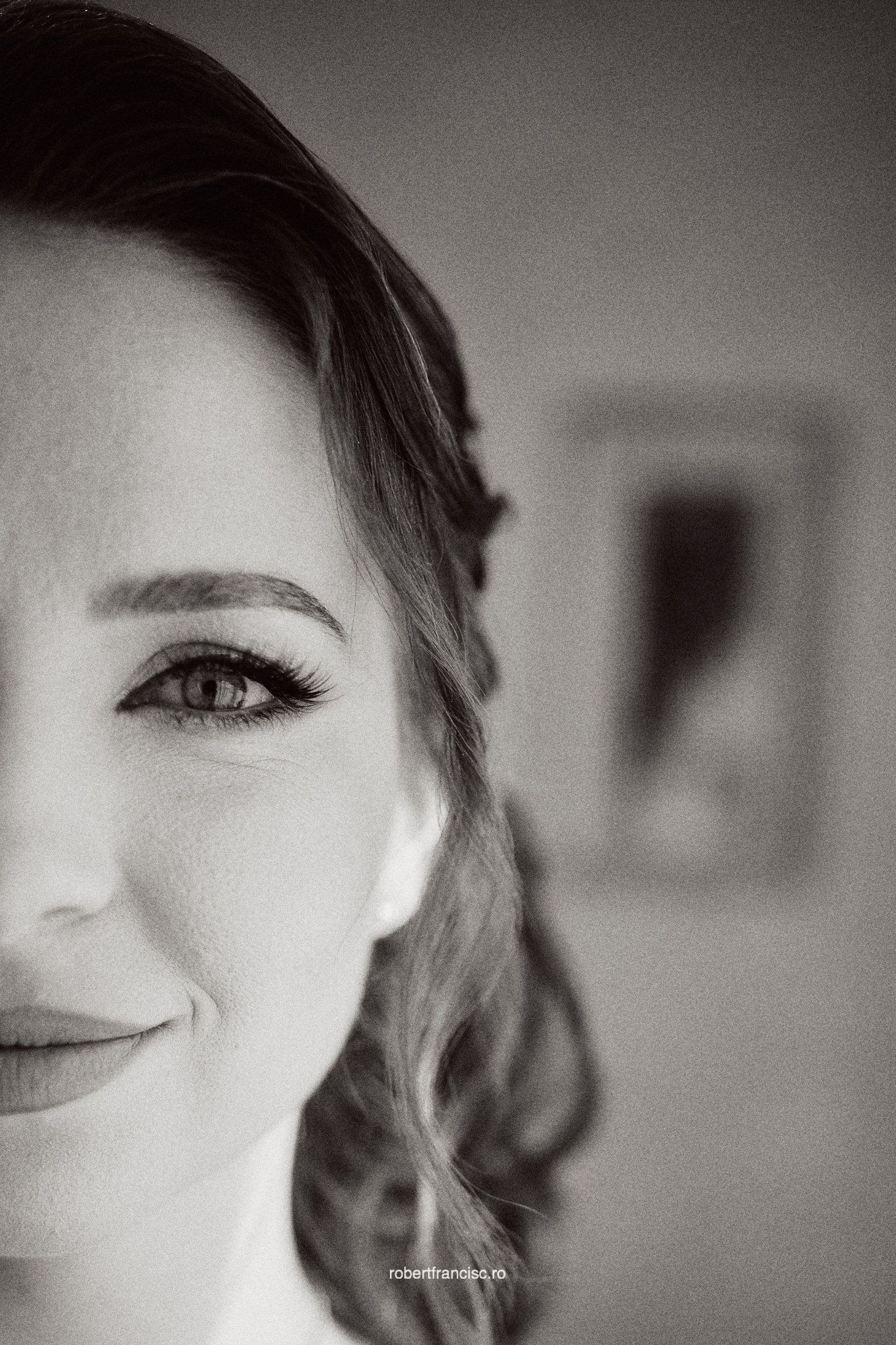 Black and white artistic portrait series showing close-up facial features with dramatic lighting and shallow depth of field.