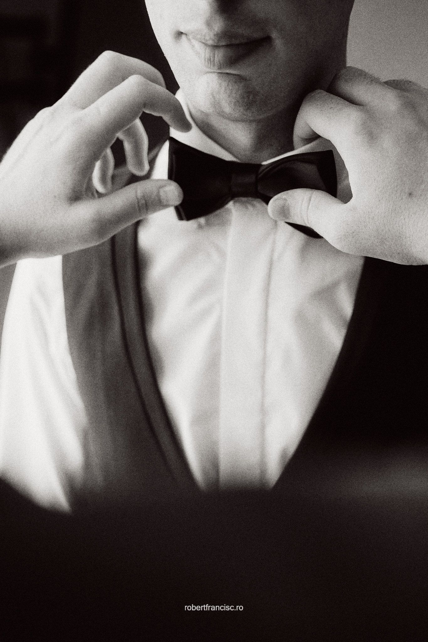 Black and white artistic fashion portrait series showing styling details and textures of a white dress shirt.