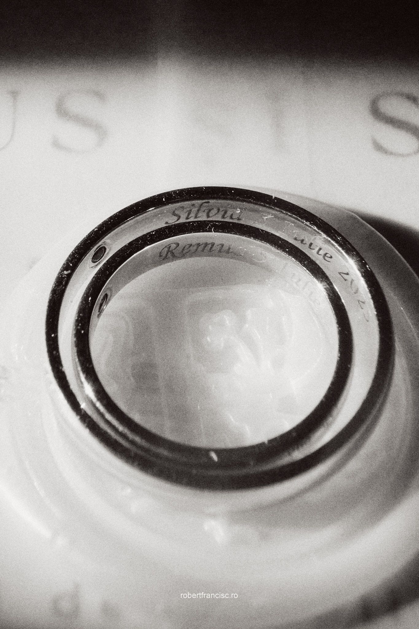 Close-up black and white image showing rippled circular rings in sequence creating a geometric pattern.
