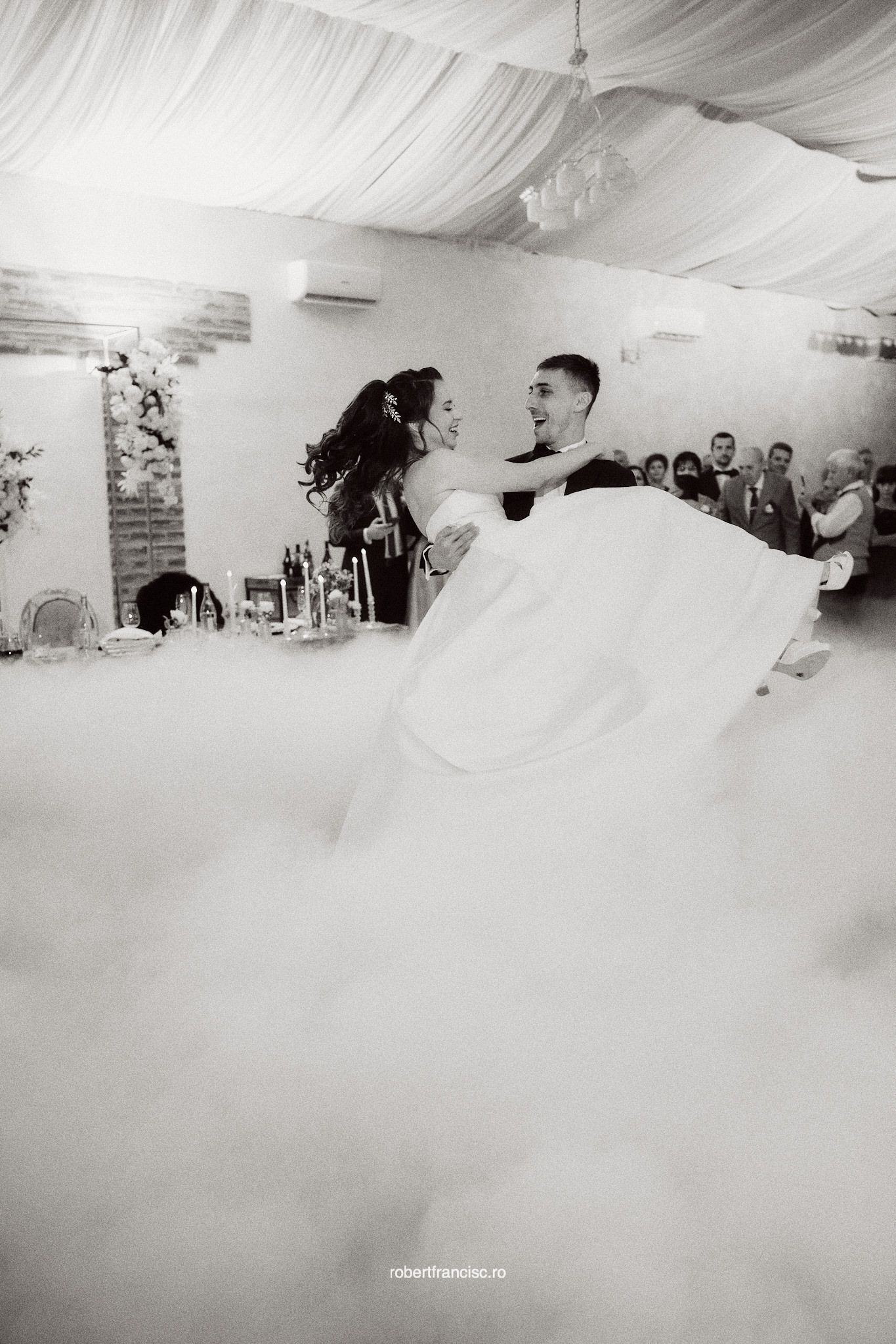 Black and white photo sequence showing a wedding couple's first dance surrounded by romantic fog on the dance floor.