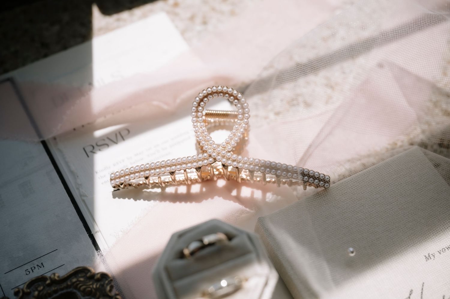 Close-up photos of sparkling diamond engagement rings and wedding bands arranged in a sequence.