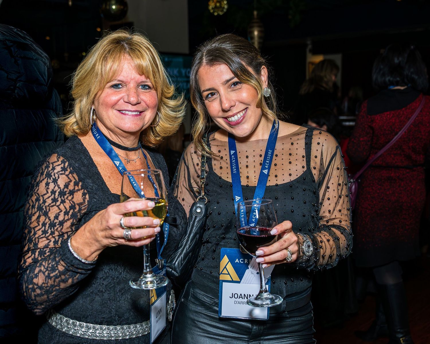 Women at Acrisure holiday party.