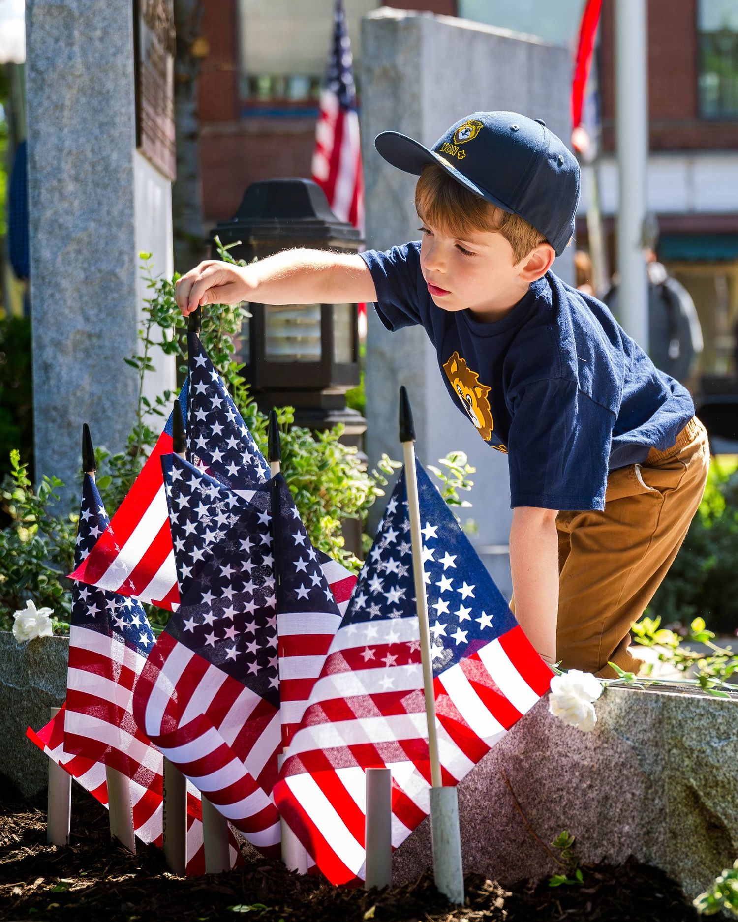 Planting a flag at Memorial Day celebration in Hillsdale, N.J..