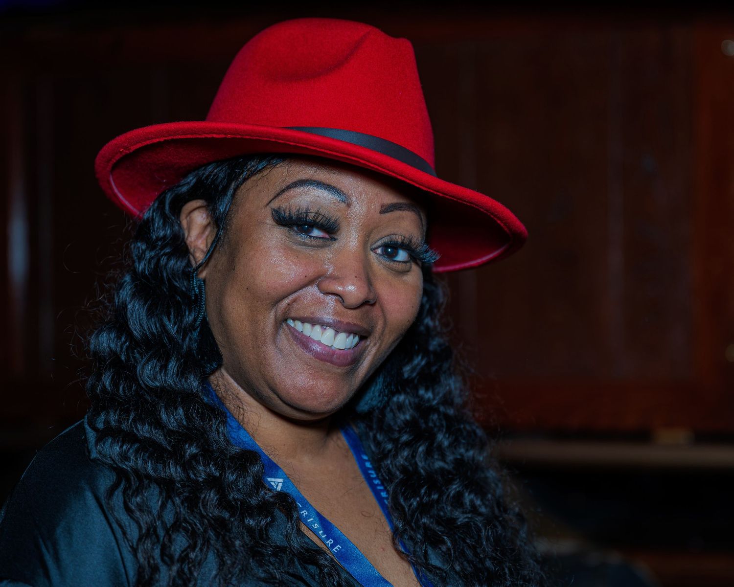 Woman at Acrisure holiday party.