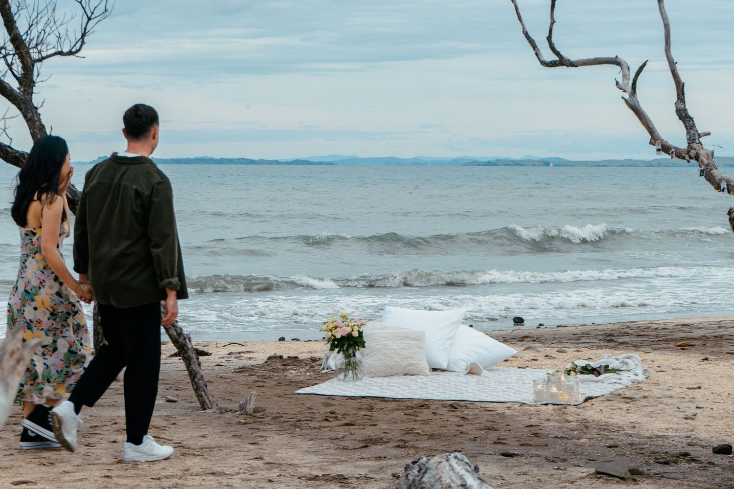 A sweet and romantic proposal at Granny's Bay, Auckland shot by YM Photography, A beautiful engagement session for the couple as well.