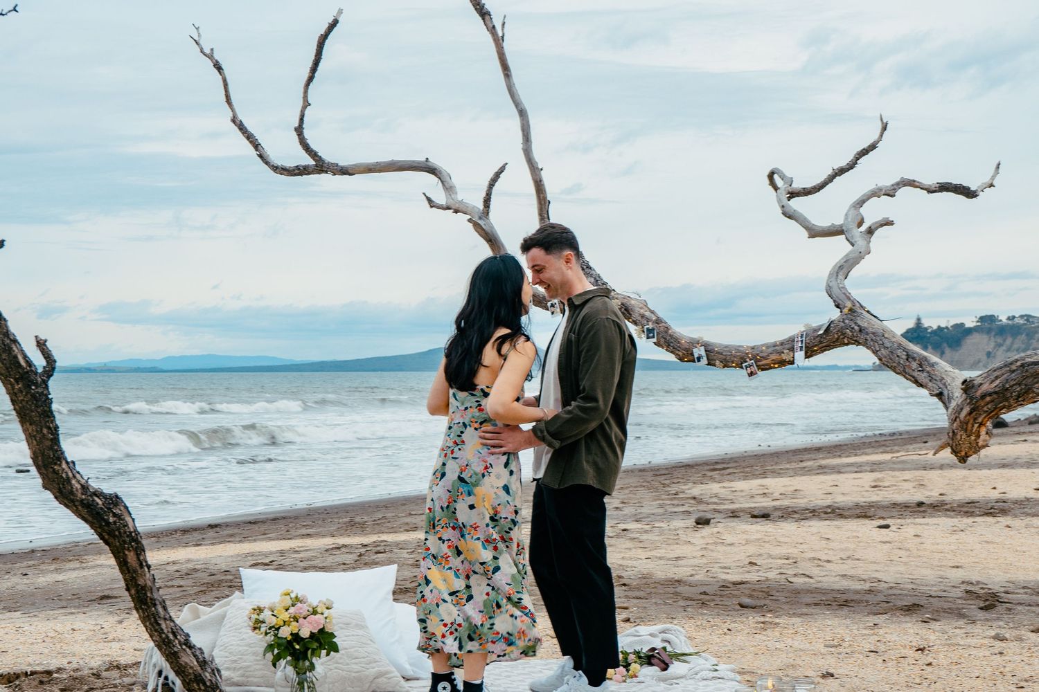 A sweet and romantic proposal at Granny's Bay, Auckland shot by YM Photography, A beautiful engagement session for the couple as well.