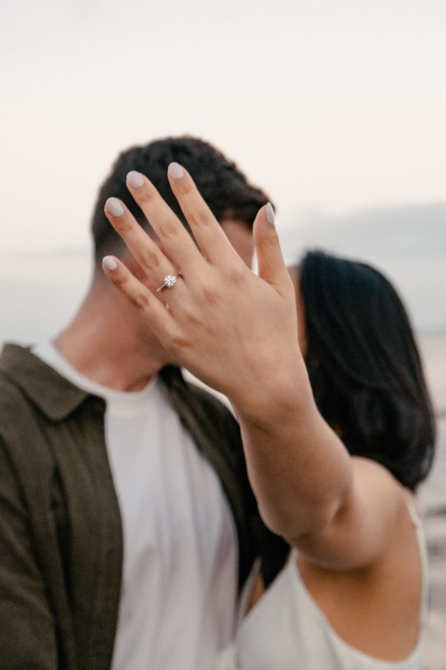 A sweet and romantic proposal at Granny's Bay, Auckland shot by YM Photography, A beautiful engagement session for the couple as well.