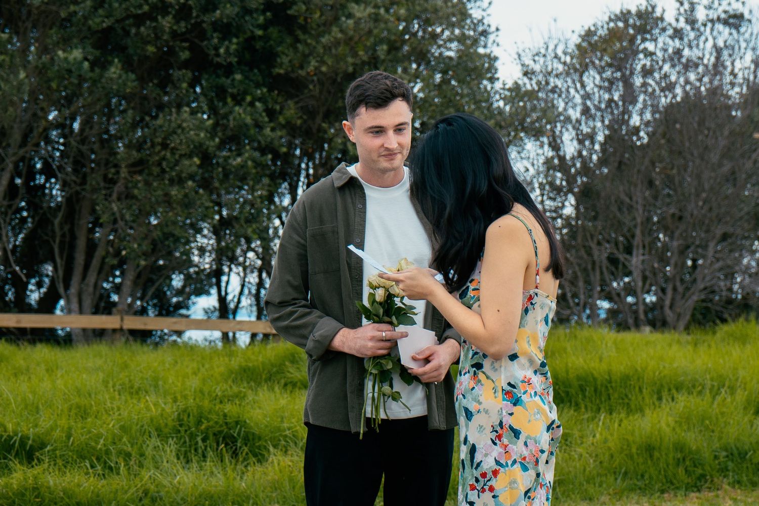 A sweet and romantic proposal at Granny's Bay, Auckland shot by YM Photography, A beautiful engagement session for the couple as well.