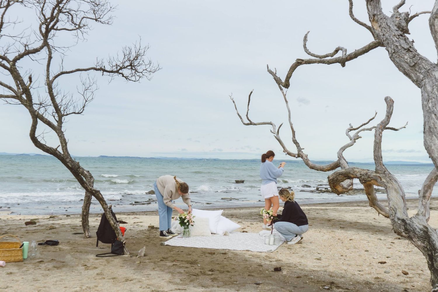 A sweet and romantic proposal at Granny's Bay, Auckland shot by YM Photography, A beautiful engagement session for the couple as well.