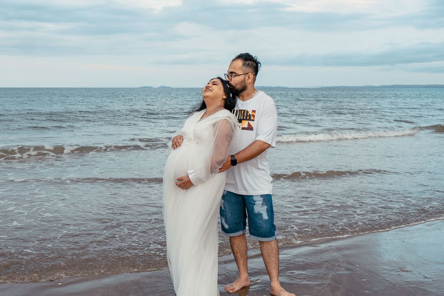 A magical maternity shoot during sunset at Long Bay Beach, Auckland.