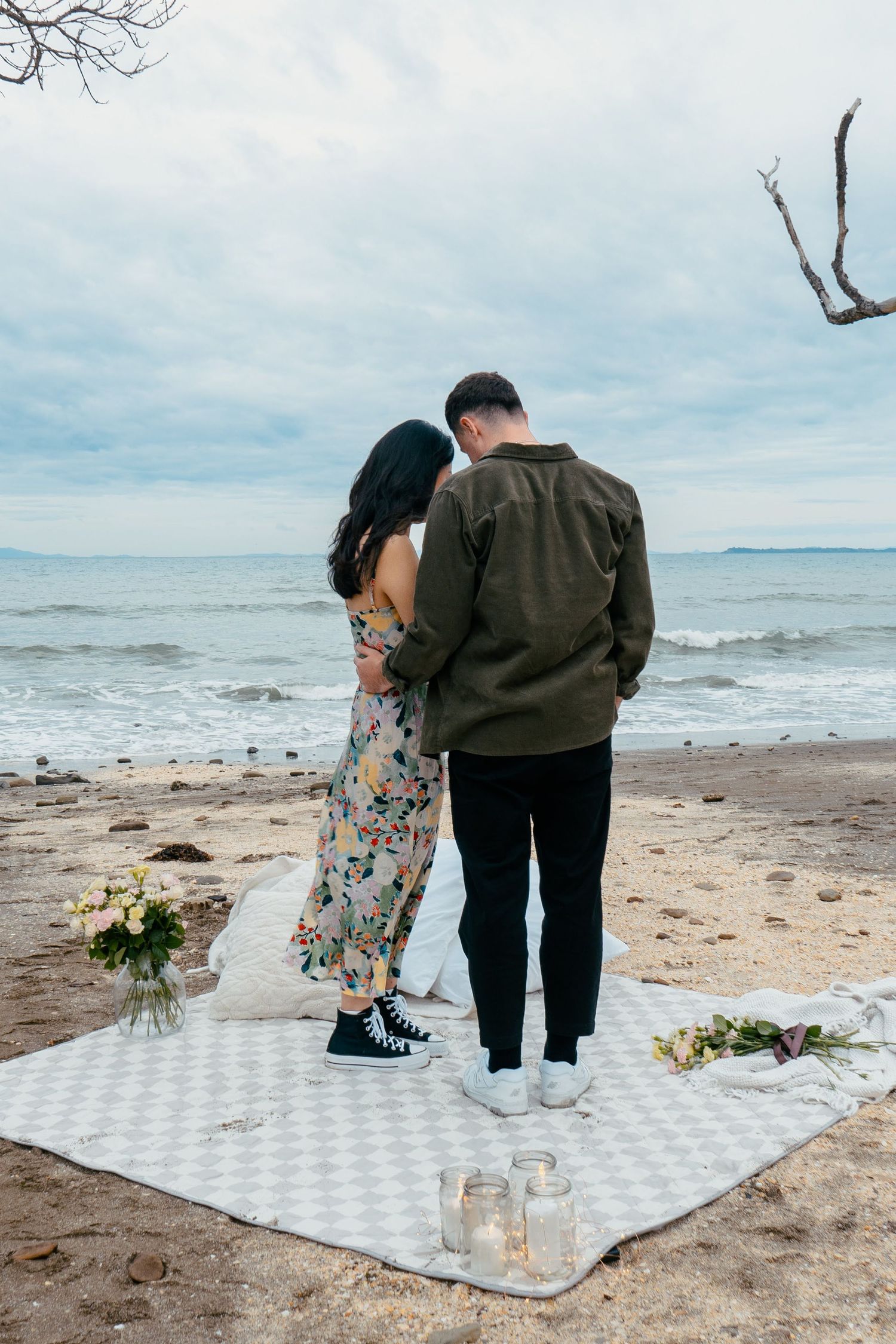 A sweet and romantic proposal at Granny's Bay, Auckland shot by YM Photography, A beautiful engagement session for the couple as well.