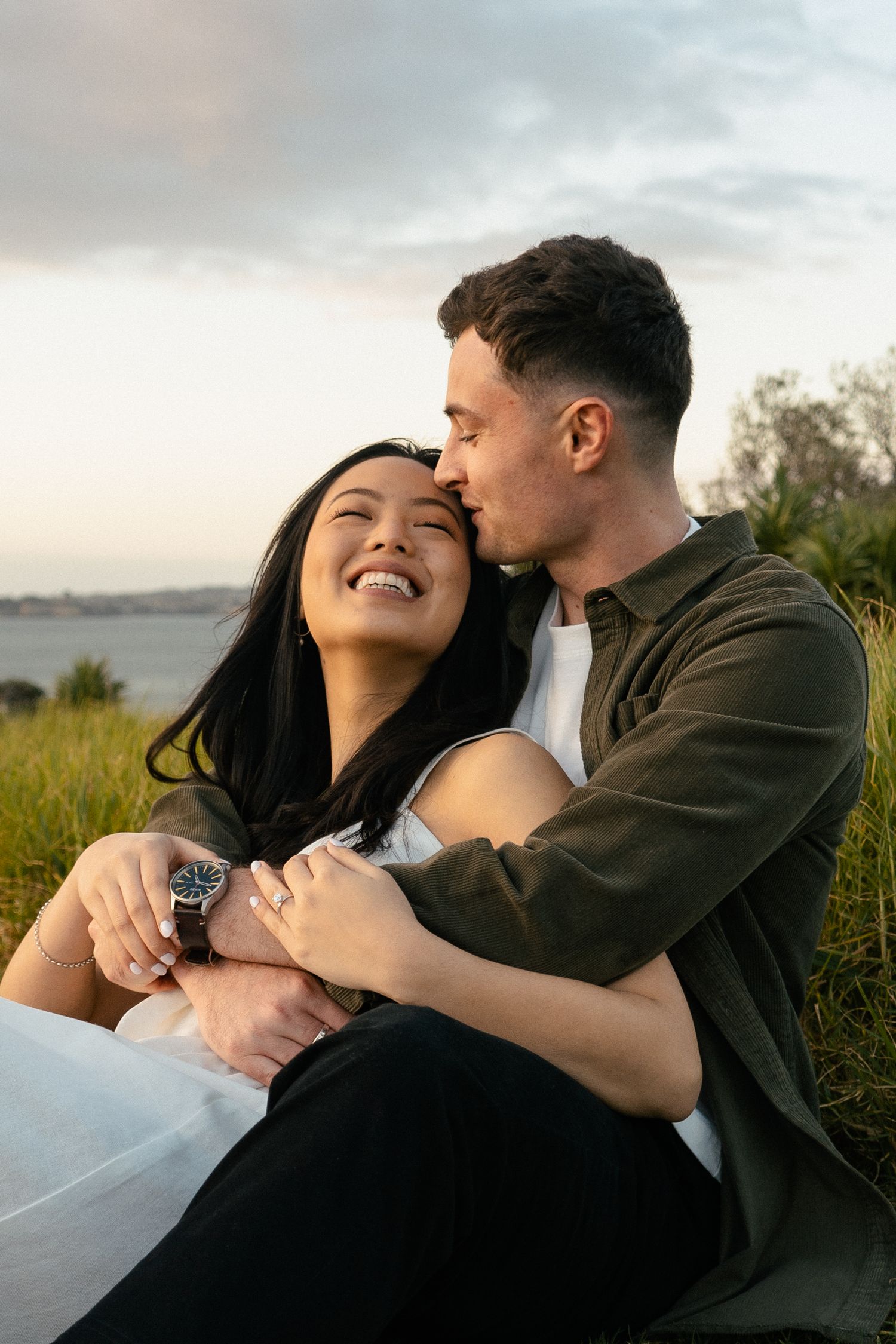 A sweet and romantic proposal at Granny's Bay, Auckland shot by YM Photography, A beautiful engagement session for the couple as well.