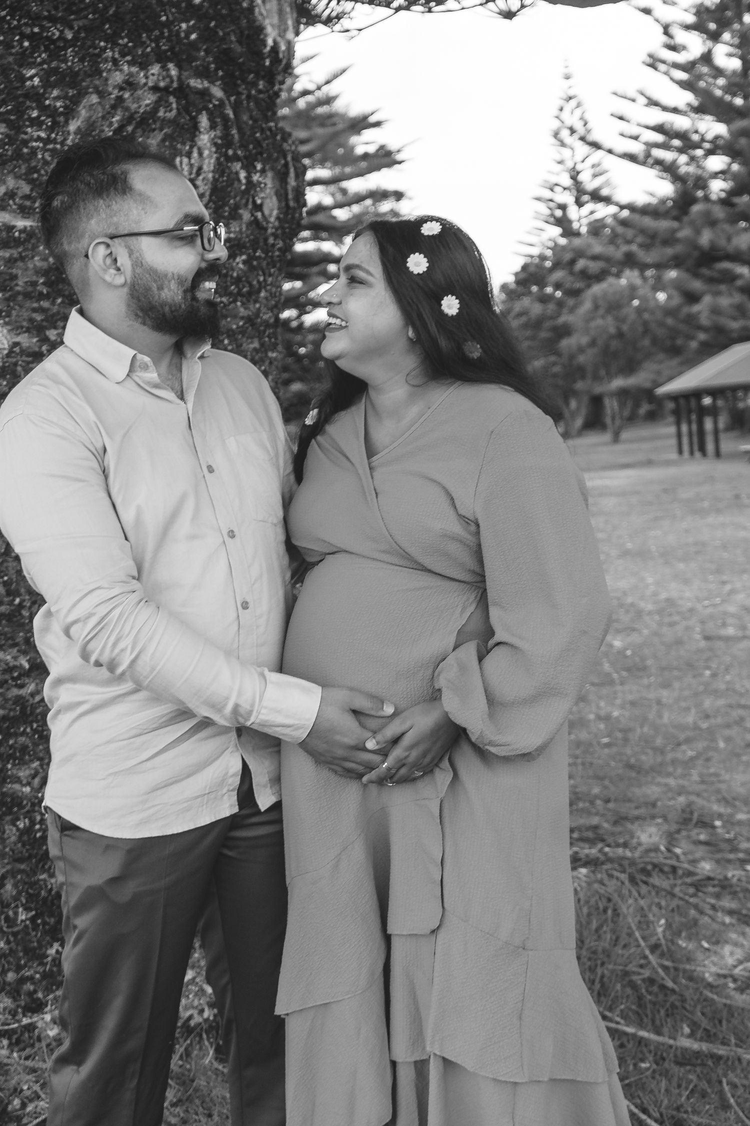 A magical maternity shoot during sunset at Long Bay Beach, Auckland.