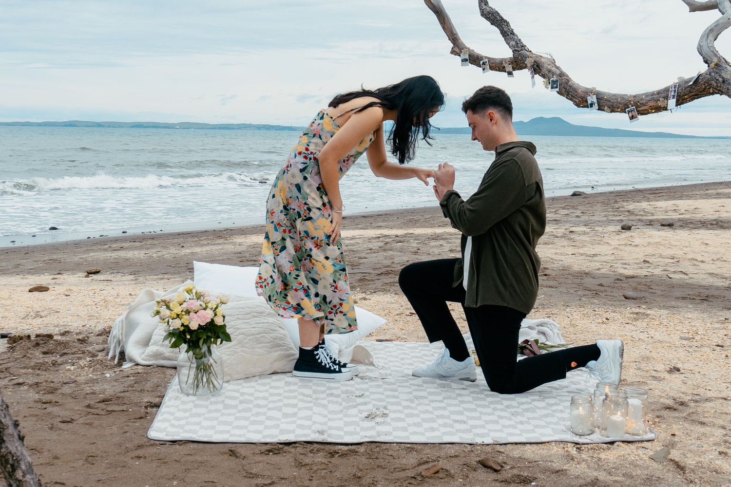 A sweet and romantic proposal at Granny's Bay, Auckland shot by YM Photography, A beautiful engagement session for the couple as well.