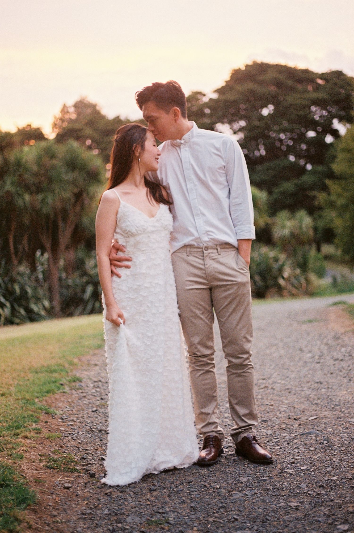 A joyful pre-wedding photoshoot at Auckland Botanical Gardens by YM Photography. Shot on digital and 35mm film.