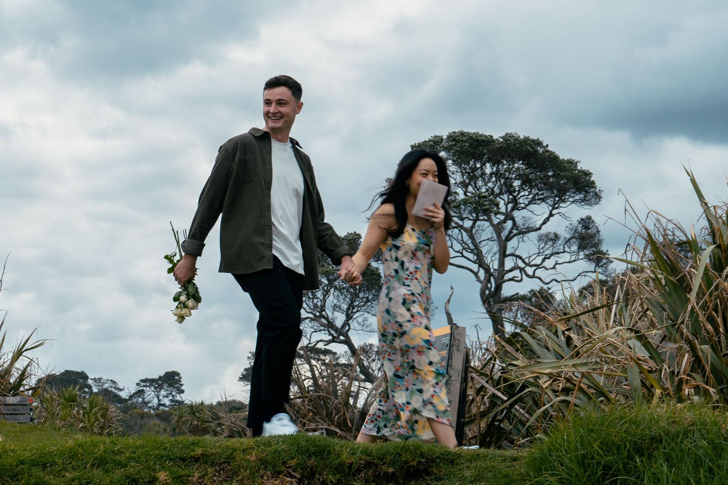 A sweet and romantic proposal at Granny's Bay, Auckland shot by YM Photography, A beautiful engagement session for the couple as well.