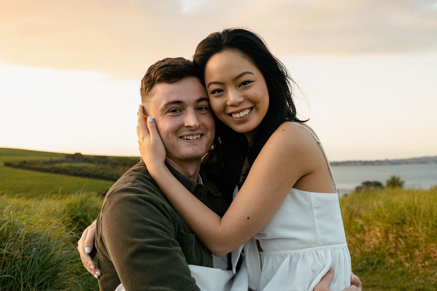 A sweet and romantic proposal at Granny's Bay, Auckland shot by YM Photography, A beautiful engagement session for the couple as well.