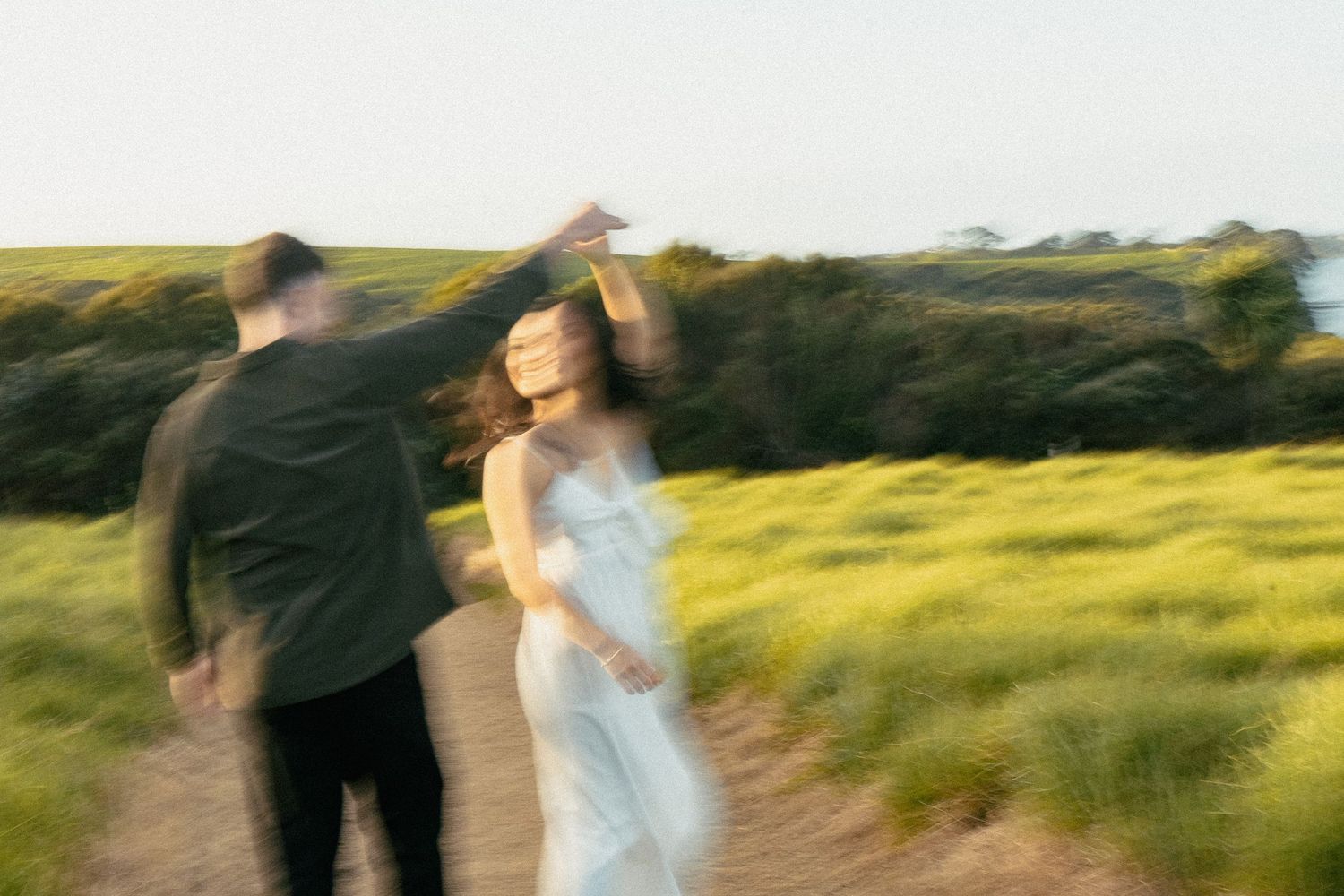 A sweet and romantic proposal at Granny's Bay, Auckland shot by YM Photography, A beautiful engagement session for the couple as well.
