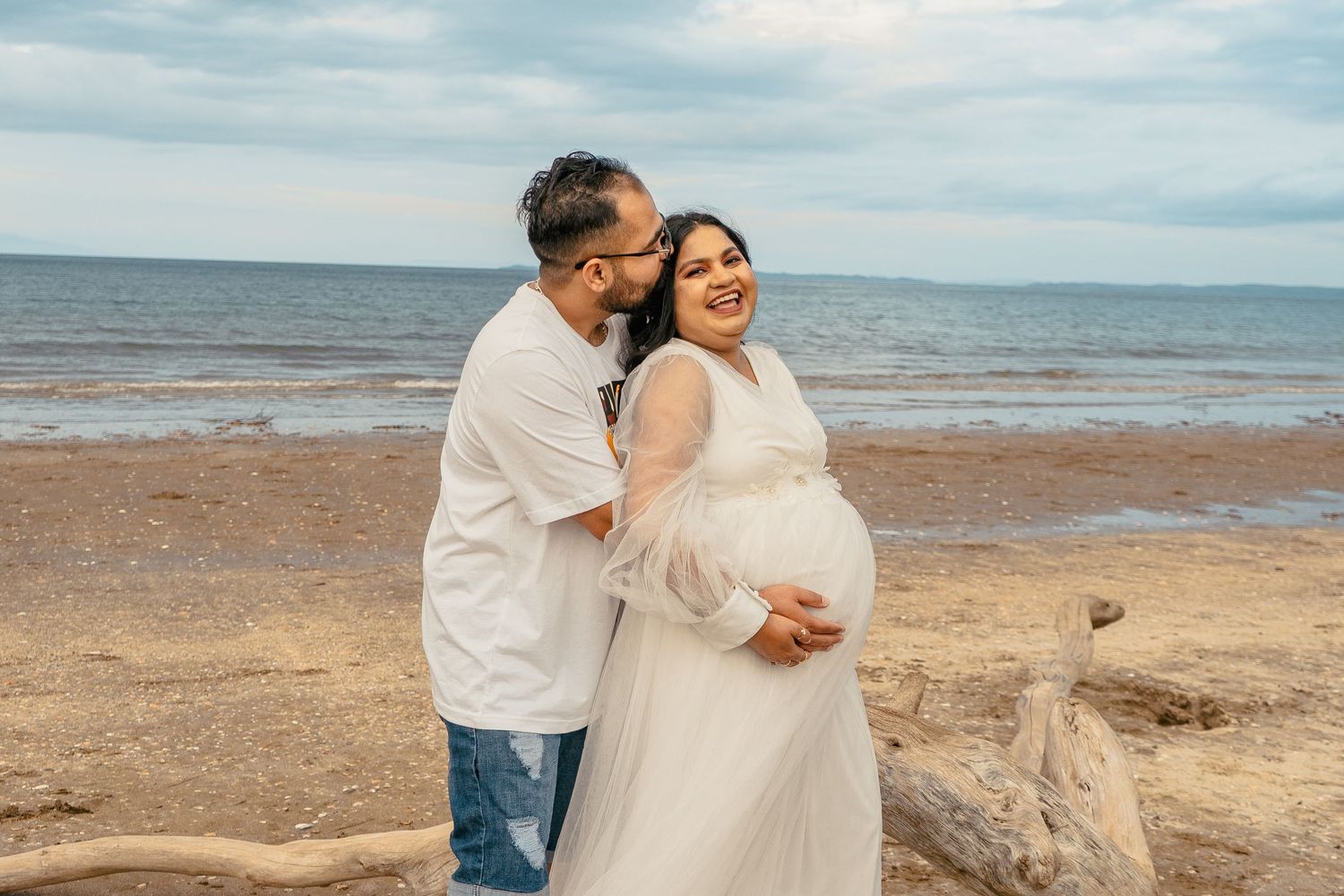 A magical maternity shoot during sunset at Long Bay Beach, Auckland.