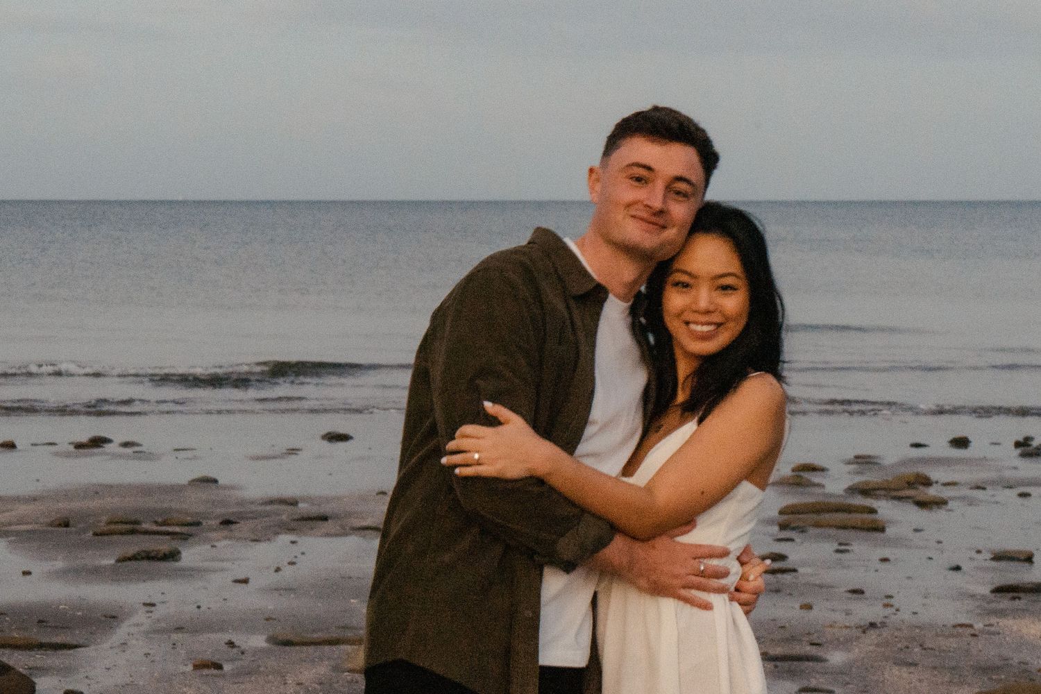 A sweet and romantic proposal at Granny's Bay, Auckland shot by YM Photography, A beautiful engagement session for the couple as well.