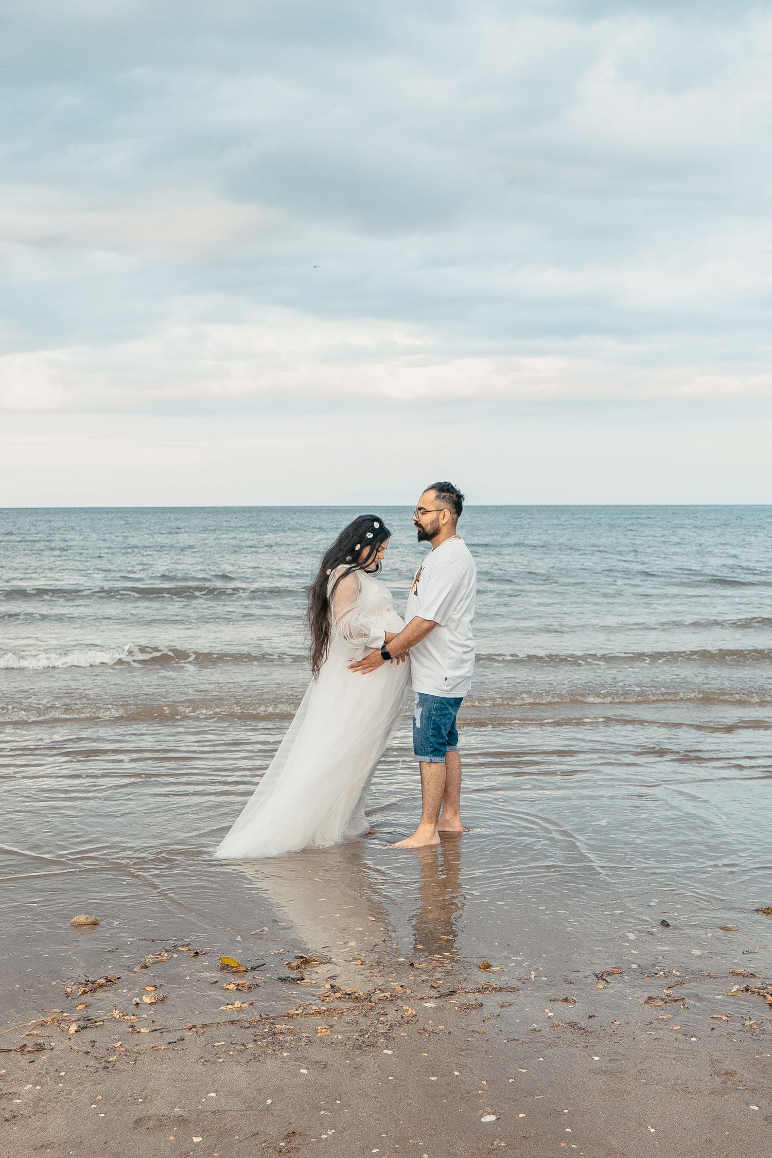 A magical maternity shoot during sunset at Long Bay Beach, Auckland.