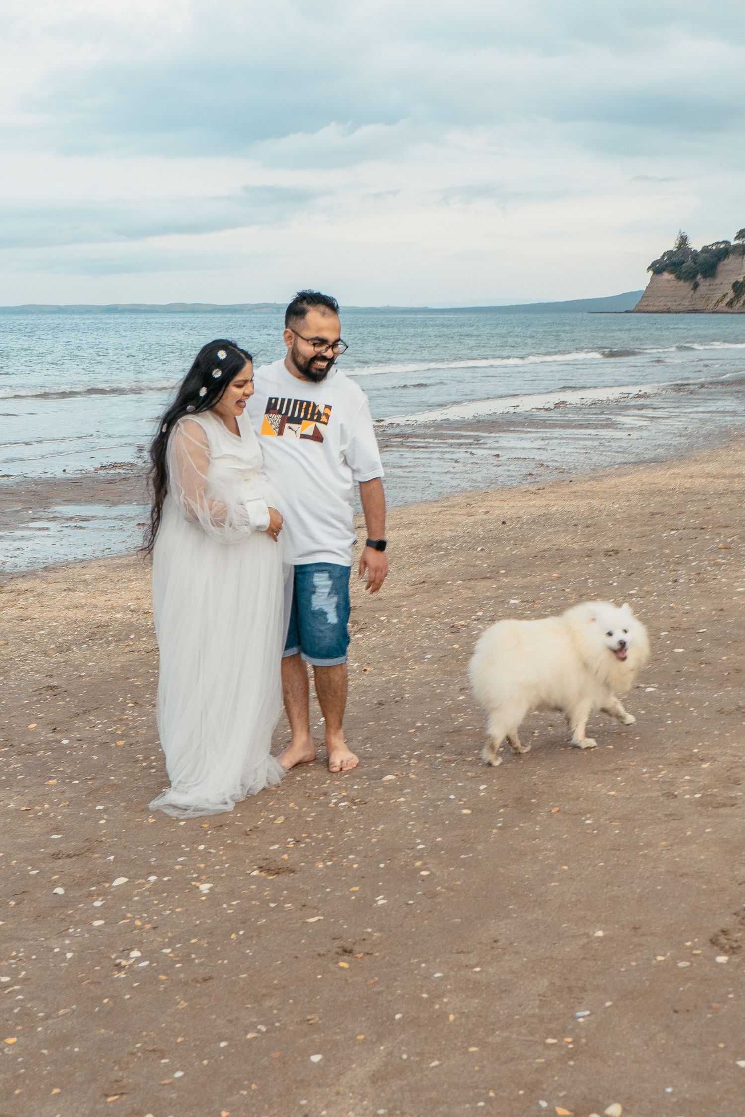 A magical maternity shoot during sunset at Long Bay Beach, Auckland.