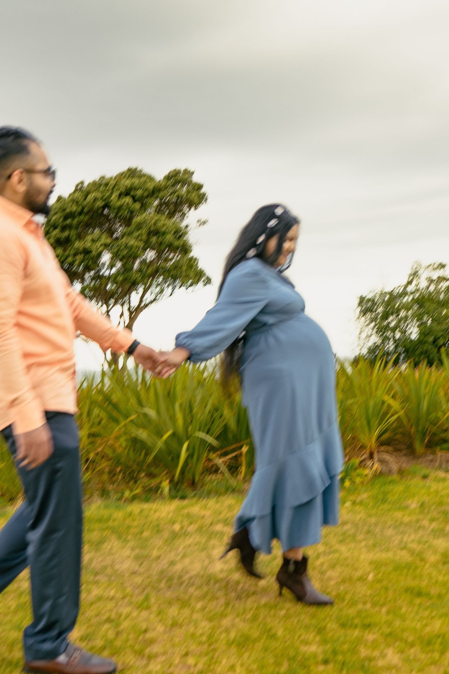 A magical maternity shoot during sunset at Long Bay Beach, Auckland.
