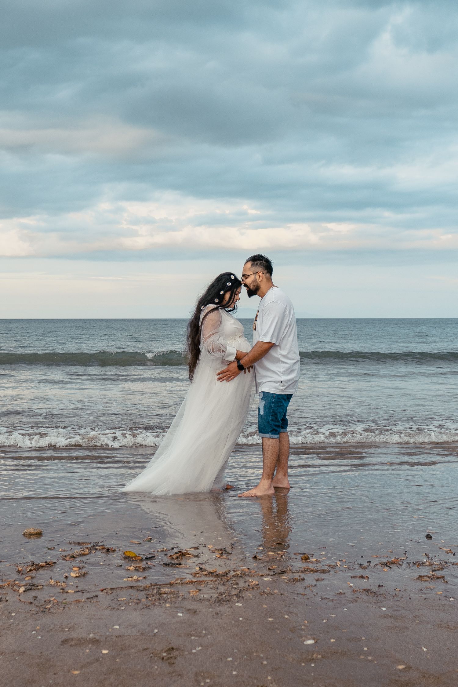 A magical maternity shoot during sunset at Long Bay Beach, Auckland.