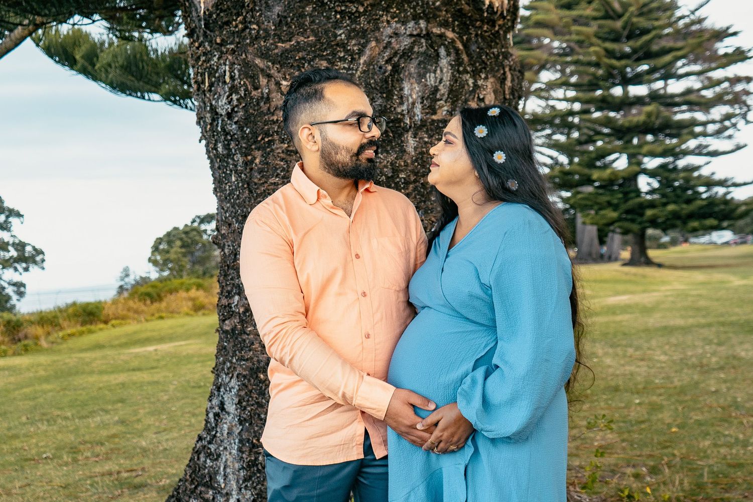 A magical maternity shoot during sunset at Long Bay Beach, Auckland.