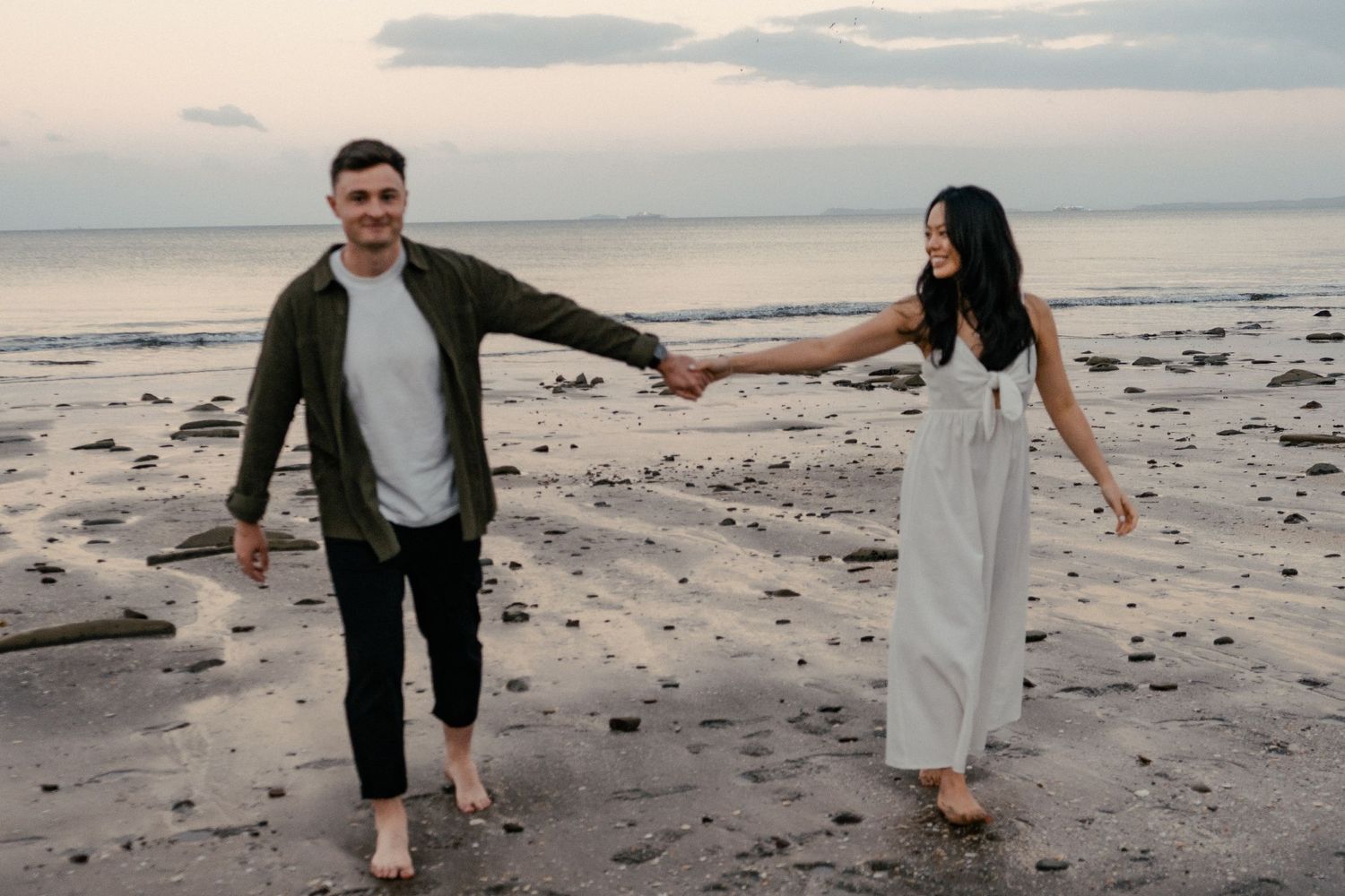 A sweet and romantic proposal at Granny's Bay, Auckland shot by YM Photography, A beautiful engagement session for the couple as well.