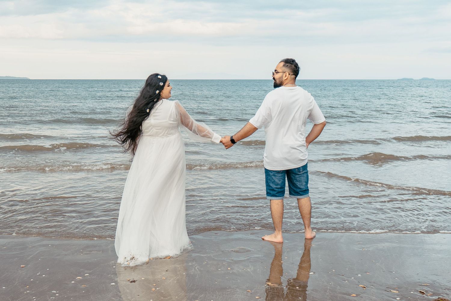 A magical maternity shoot during sunset at Long Bay Beach, Auckland.