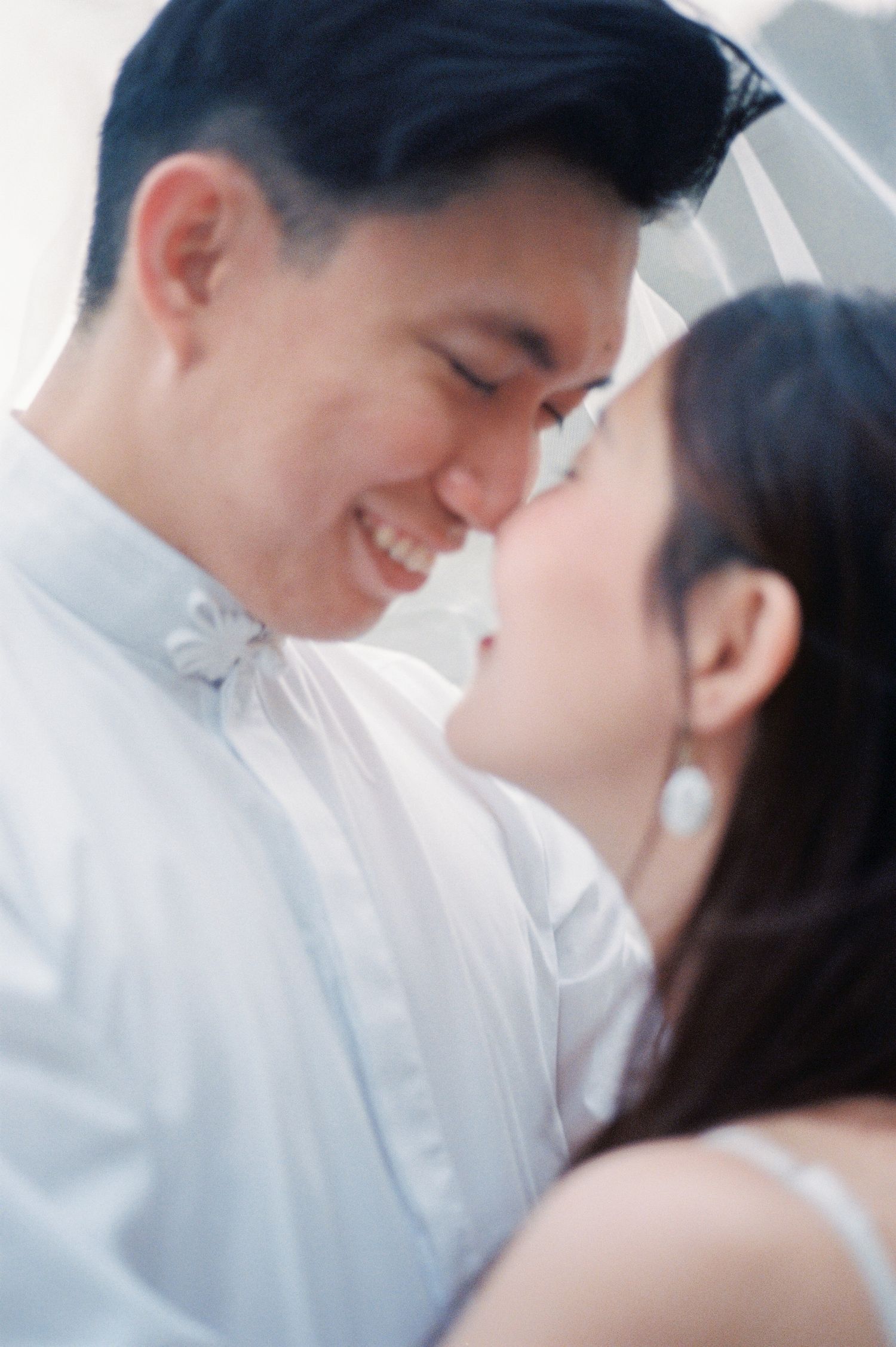 A joyful pre-wedding photoshoot at Auckland Botanical Gardens by YM Photography. Shot on digital and 35mm film.