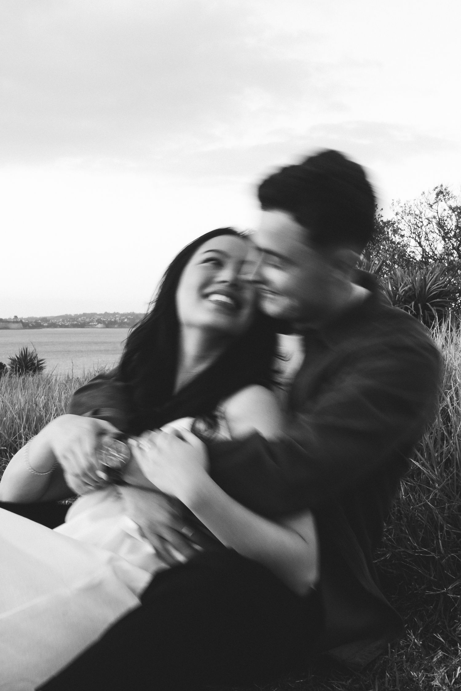 A sweet and romantic proposal at Granny's Bay, Auckland shot by YM Photography, A beautiful engagement session for the couple as well.