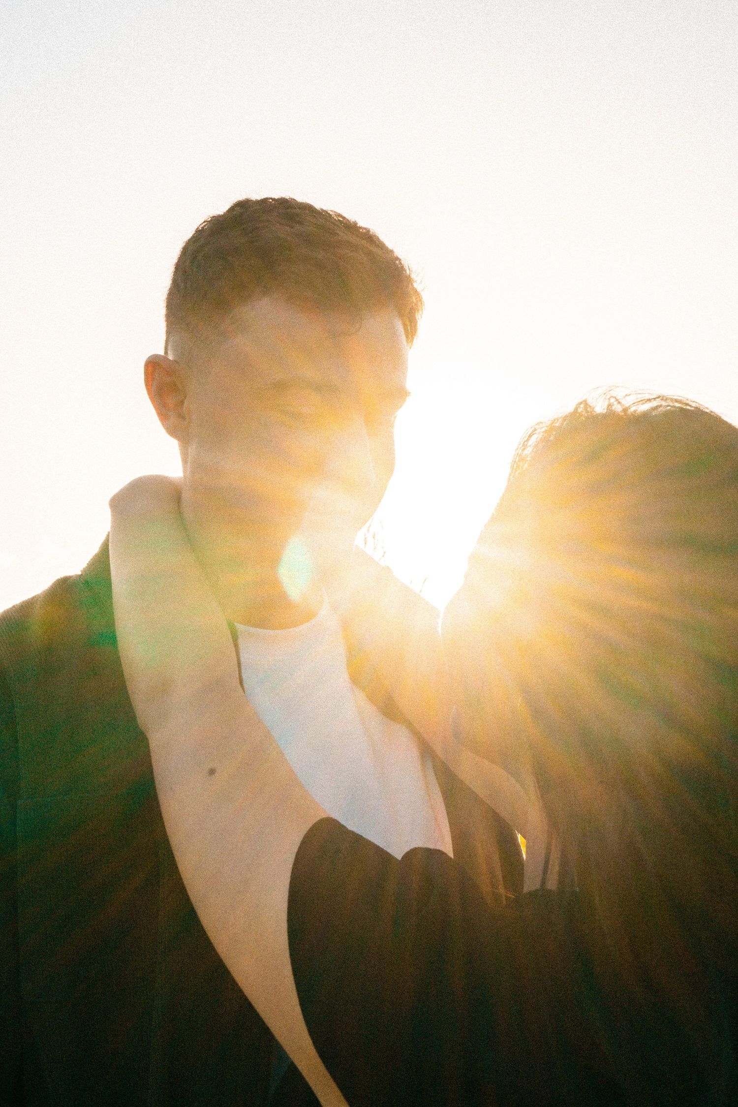 A sweet and romantic proposal at Granny's Bay, Auckland shot by YM Photography, A beautiful engagement session for the couple as well.