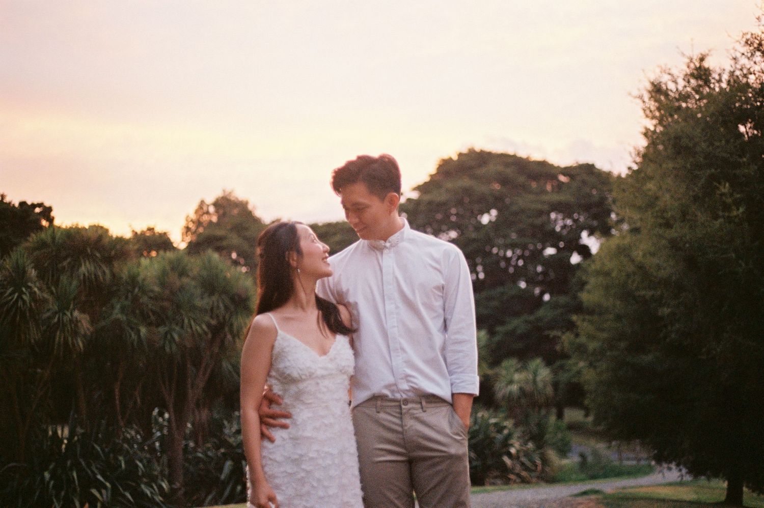 A joyful pre-wedding photoshoot at Auckland Botanical Gardens by YM Photography. Shot on digital and 35mm film.