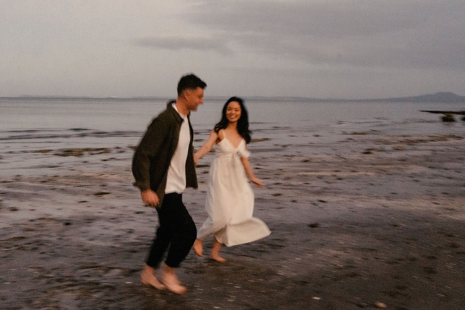 A sweet and romantic proposal at Granny's Bay, Auckland shot by YM Photography, A beautiful engagement session for the couple as well.