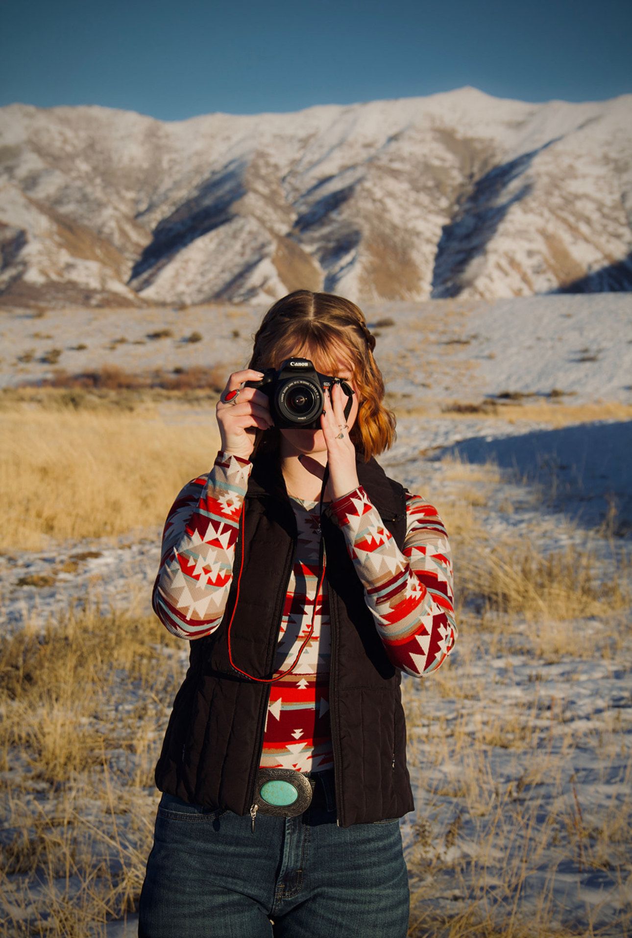 photograpgher covering face with camera