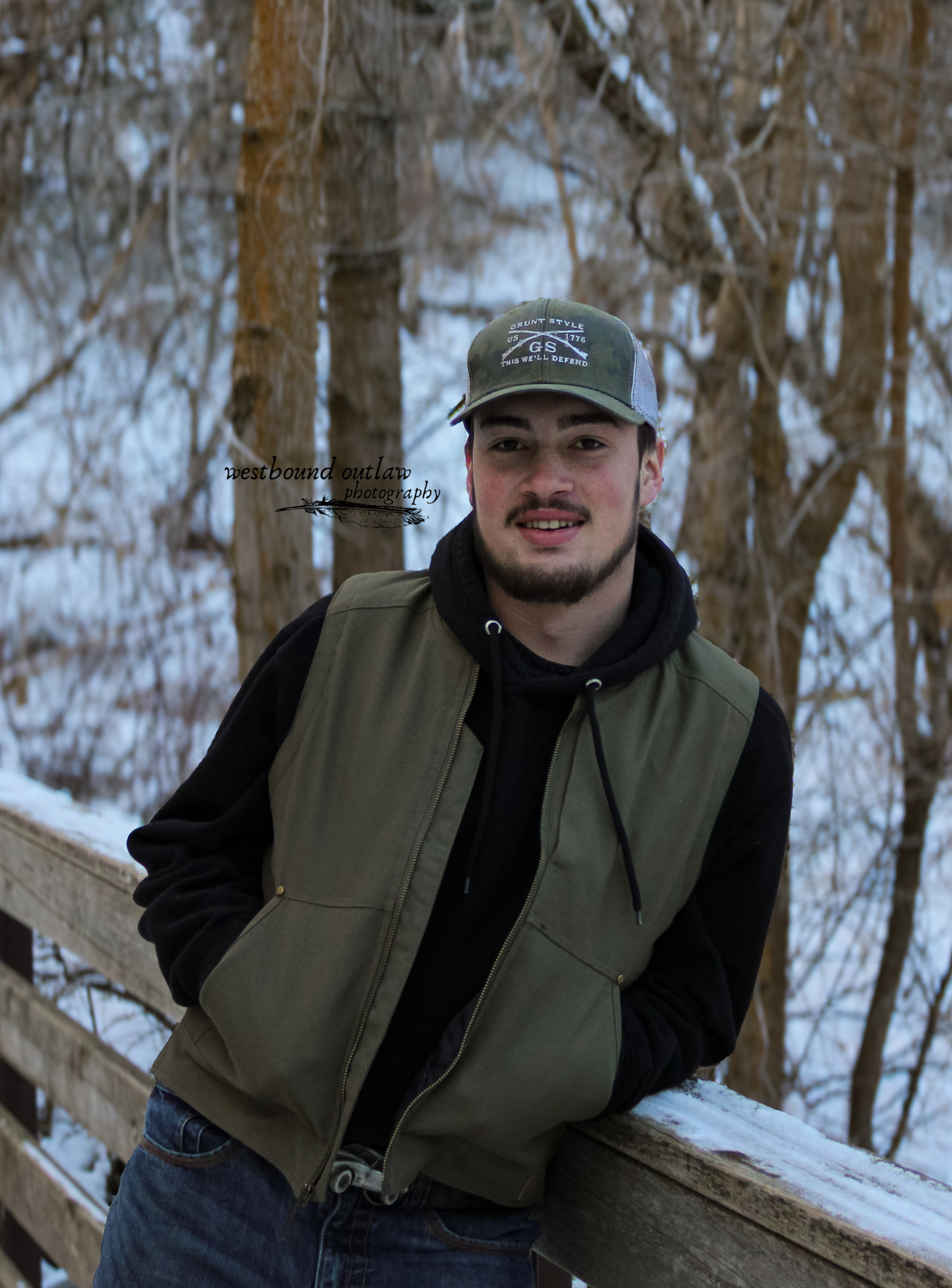 man leaning against bridge