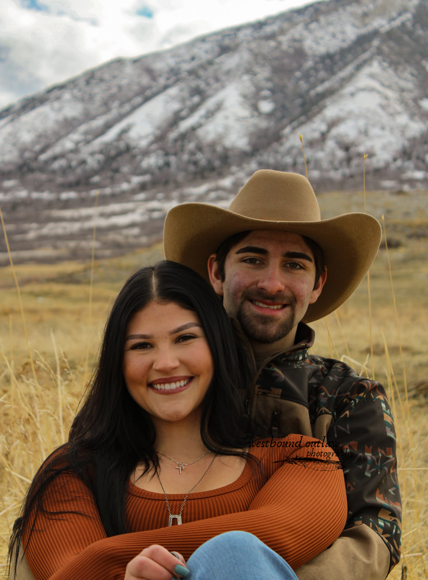 husband and wife smiling at camera