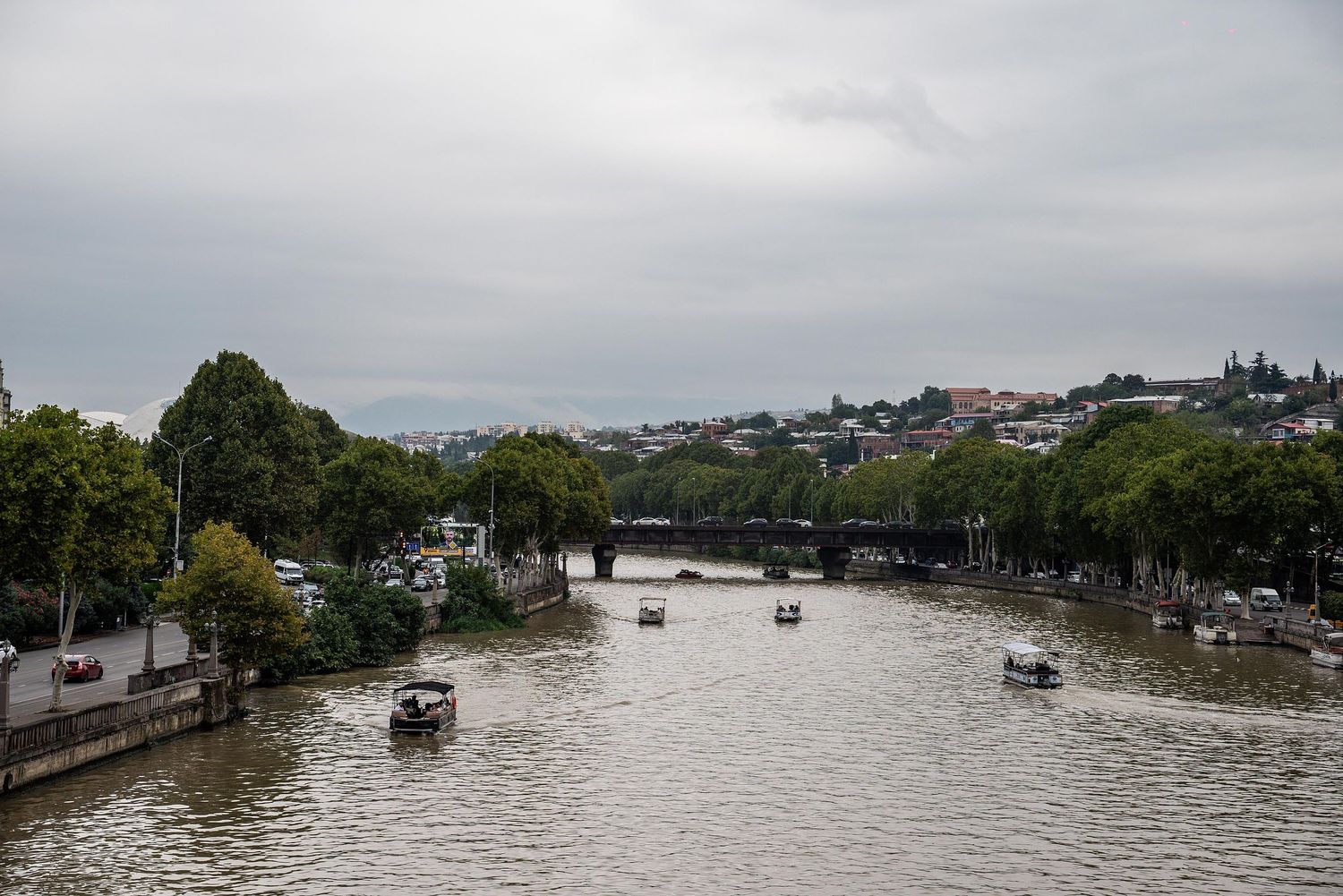 Aerial view of flooded Brisbane River with submerged buildings and trees during a major flood event.