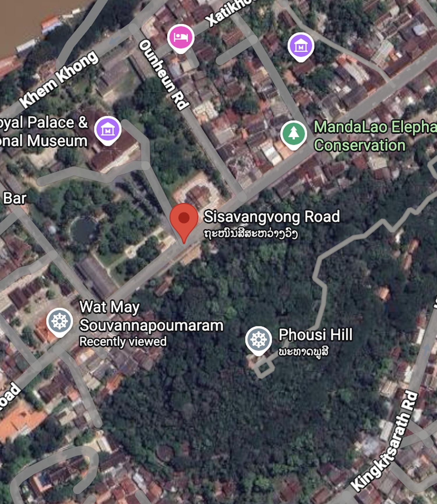 Aerial satellite view of Phousi Hill and Royal Palace Museum area in Luang Prabang, Laos showing streets and buildings.